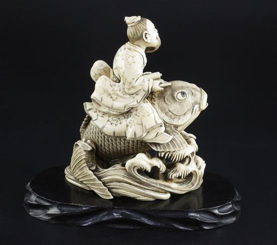 A Japanese ivory okimono of Kinko riding a carp, signed Ichyosen Naohide, 19th century, height 12.8cm, wood stand